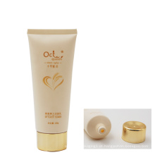 China 100g cosméticos recipientes limpador facial tubo com tampa de rosca de ouro